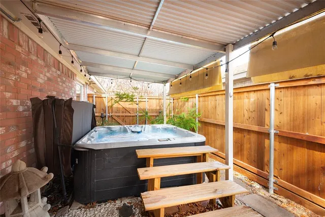 a view of house with backyard and tree