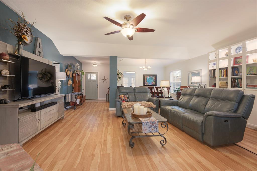 7613 Dockside Drive Rowlett, TX 75088 - Photo 3 of 40 a living room with furniture and a flat screen tv