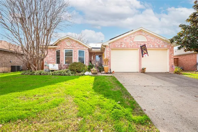 a kitchen with stainless steel appliances a stove sink microwave and cabinets