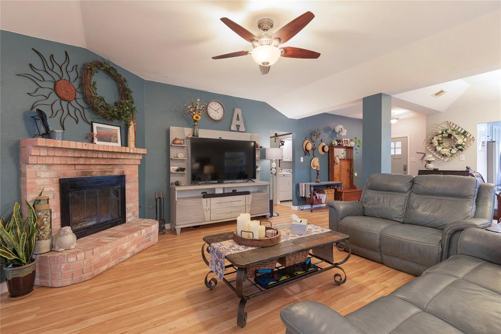 7613 Dockside Drive Rowlett, TX 75088 - Photo 39 of 40 a living room with furniture fireplace and a flat screen tv