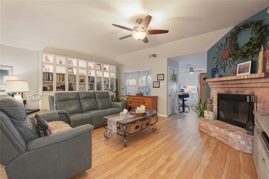 7613 Dockside Drive Rowlett, TX 75088 - Photo 5 of 40 a living room with furniture and a fireplace