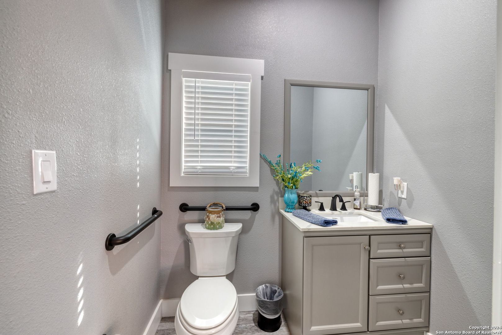 93 North Saddle Mountain Road Rio Frio, TX 78879 - Photo 18 of 50 a bathroom with a sink a toilet and mirror
