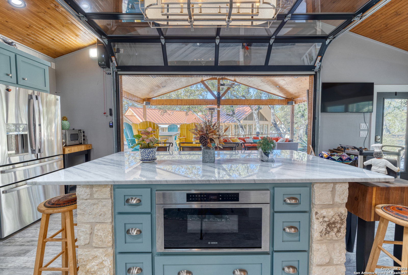 93 North Saddle Mountain Road Rio Frio, TX 78879 - Photo 19 of 50 a kitchen with stainless steel appliances granite countertop a stove a sink and a microwave