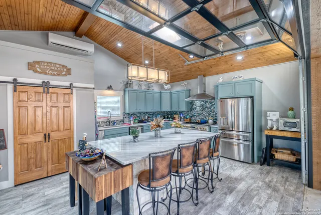 a view of a patio with a table and chairs
