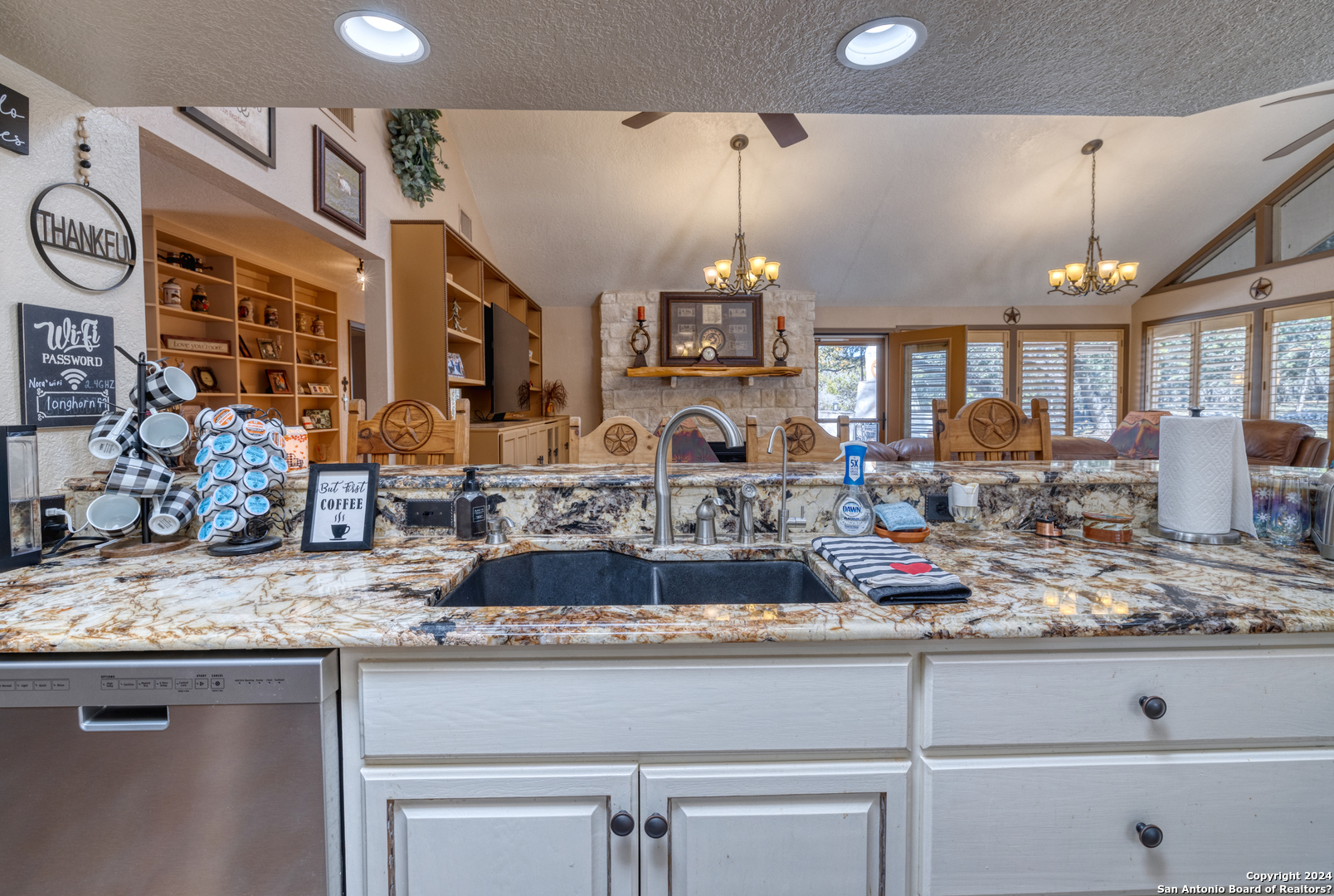 93 North Saddle Mountain Road Rio Frio, TX 78879 - Photo 27 of 50 a kitchen with stainless steel appliances granite countertop a sink and cabinets