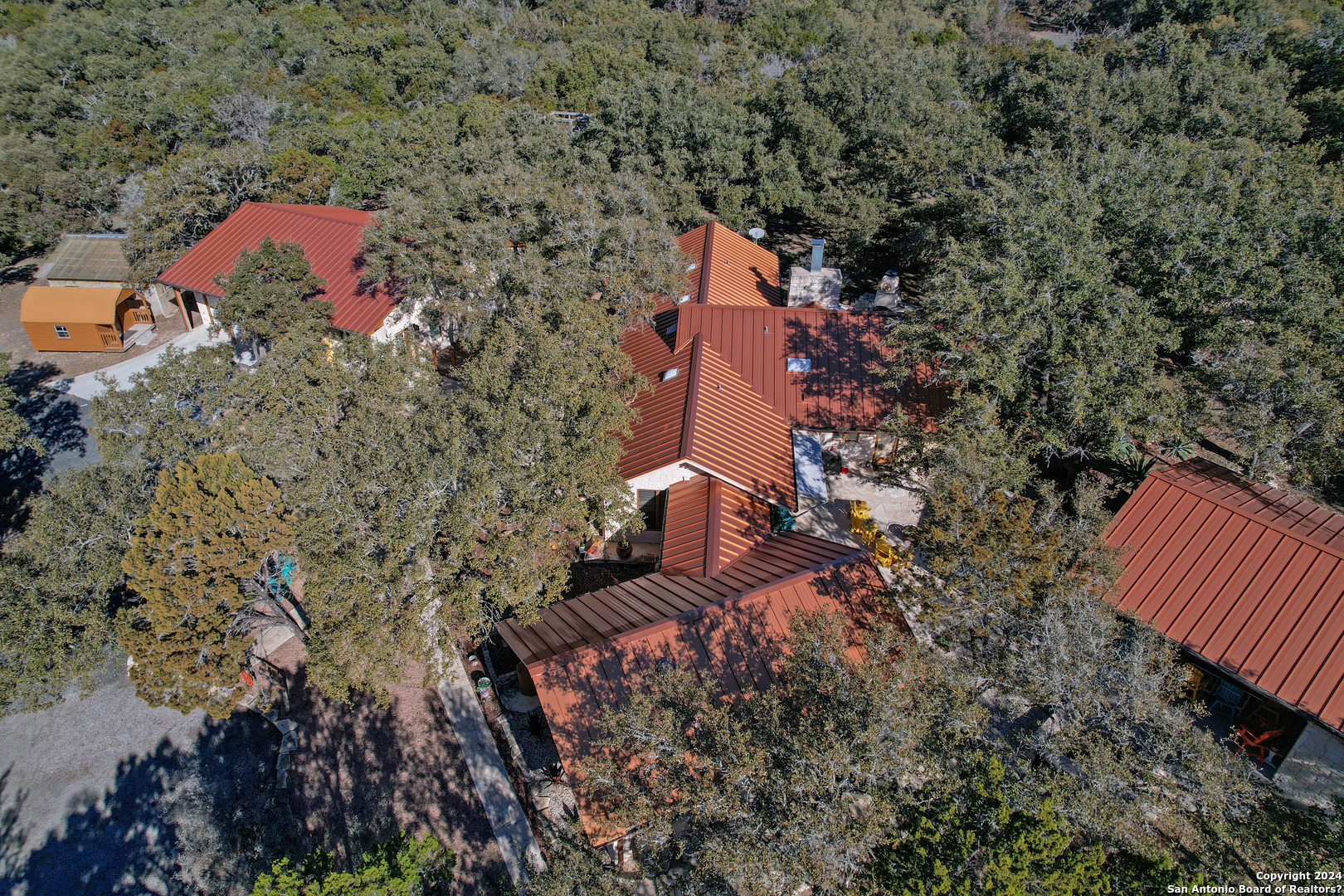 93 North Saddle Mountain Road Rio Frio, TX 78879 - Photo 47 of 50 an aerial view of a house with a yard and trees