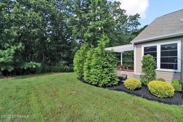 a front view of a house with garden and porch