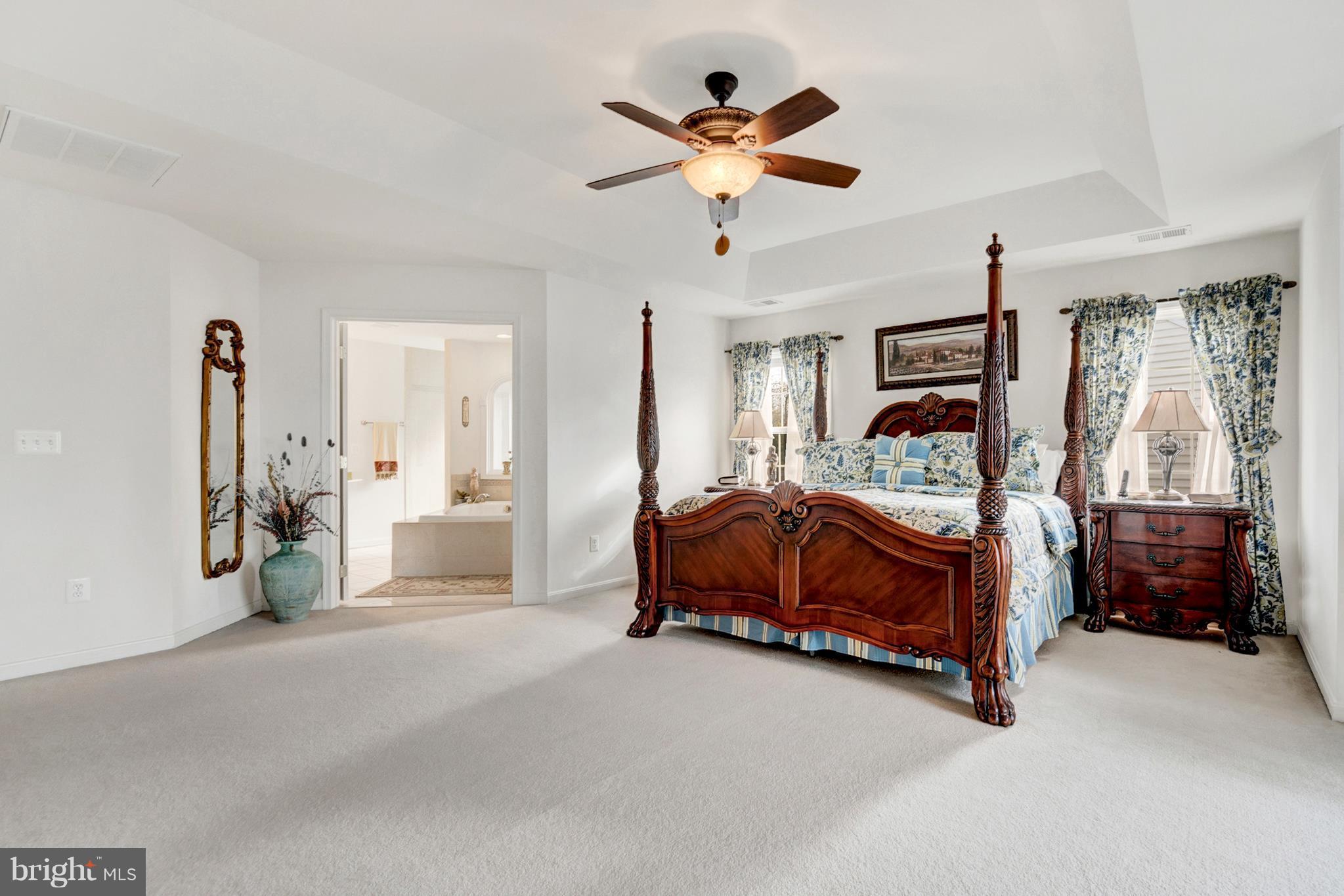 842 Kingsbrook Road Culpeper, VA 22701 - Photo 21 of 30 a bedroom with a bed and a large walk in closet