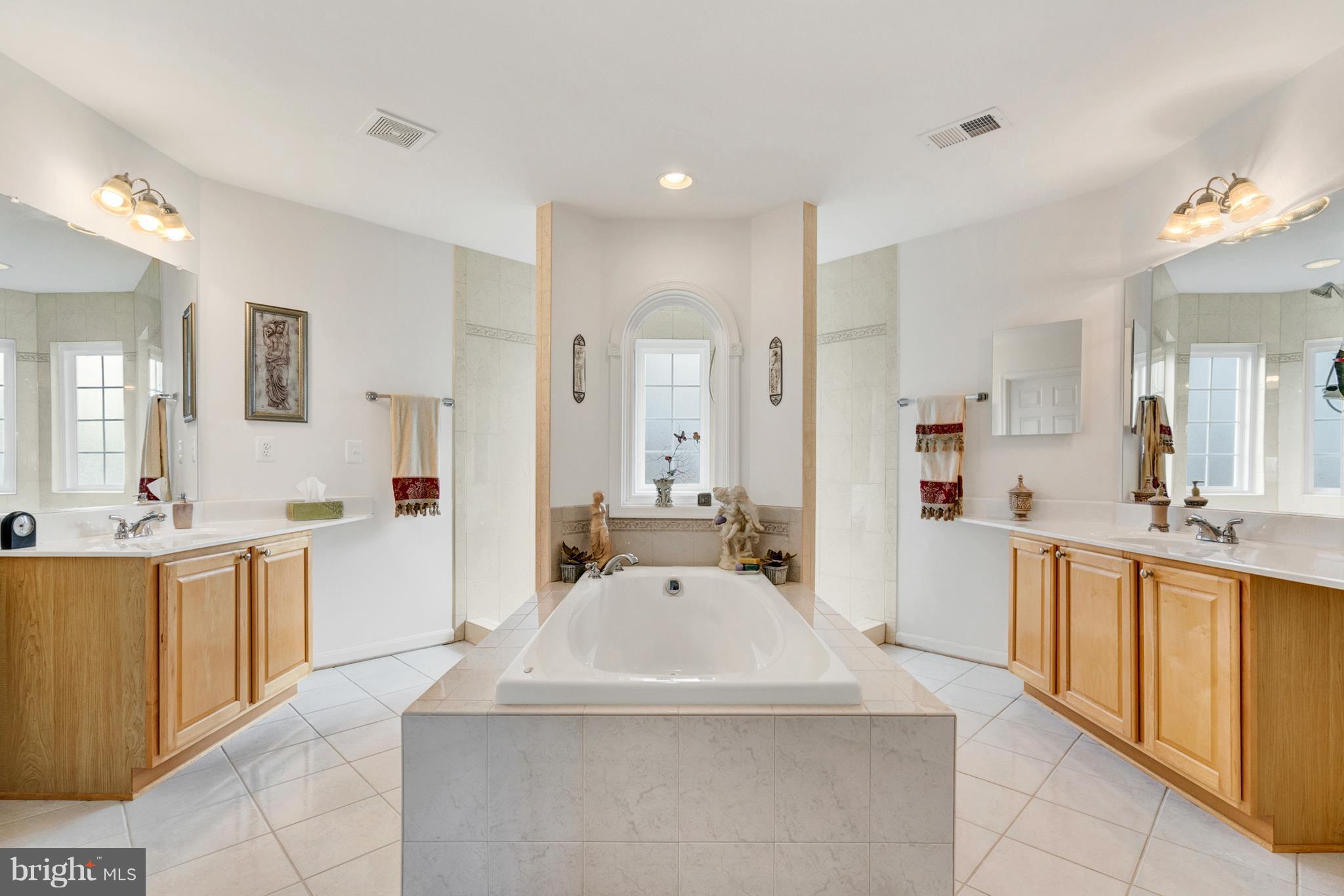 842 Kingsbrook Road Culpeper, VA 22701 - Photo 22 of 30 a large white kitchen with a large counter top space a sink stainless steel appliances and cabinets