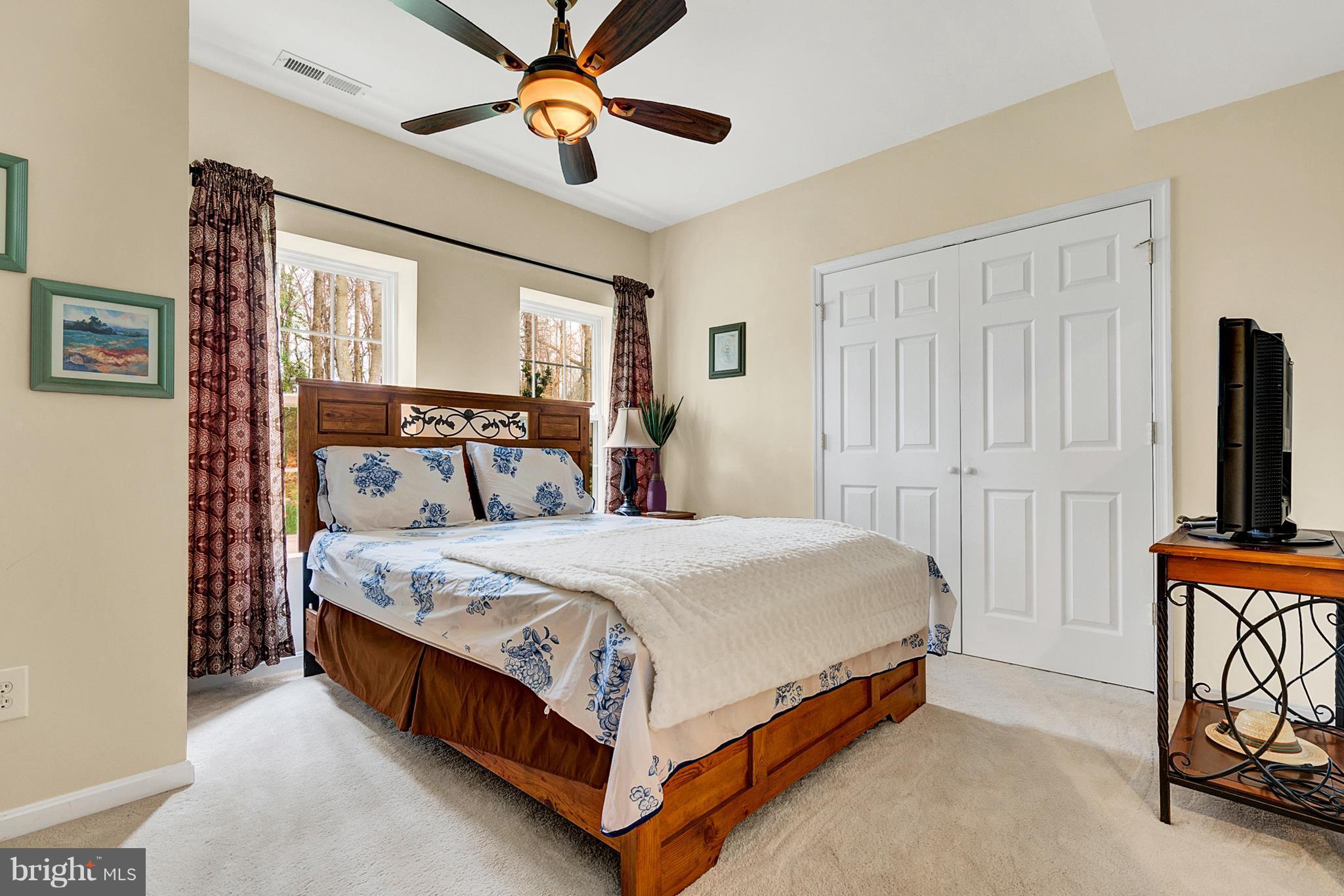 842 Kingsbrook Road Culpeper, VA 22701 - Photo 26 of 30 a bed sitting in a bedroom next to a window