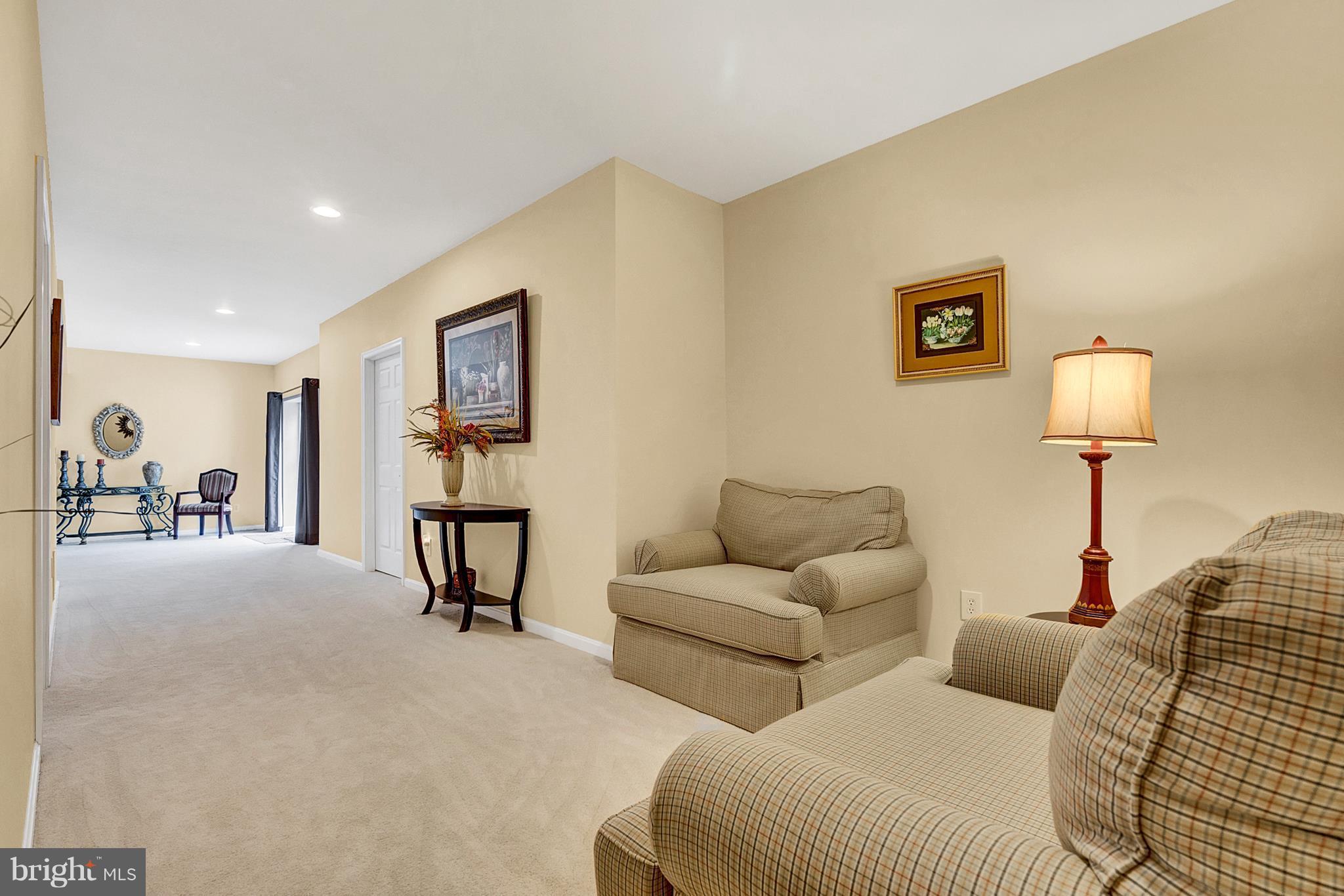 842 Kingsbrook Road Culpeper, VA 22701 - Photo 28 of 30 a living room with furniture and a lamp