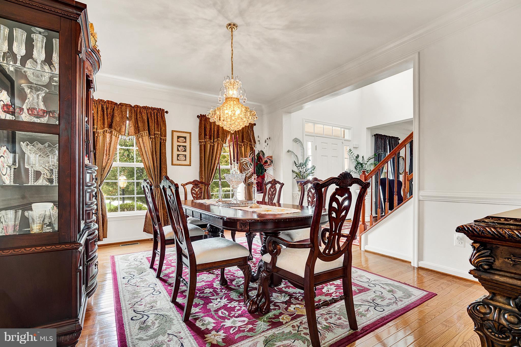 842 Kingsbrook Road Culpeper, VA 22701 - Photo 6 of 30 a view of a dining room and livingroom with furniture wooden floor a chandelier