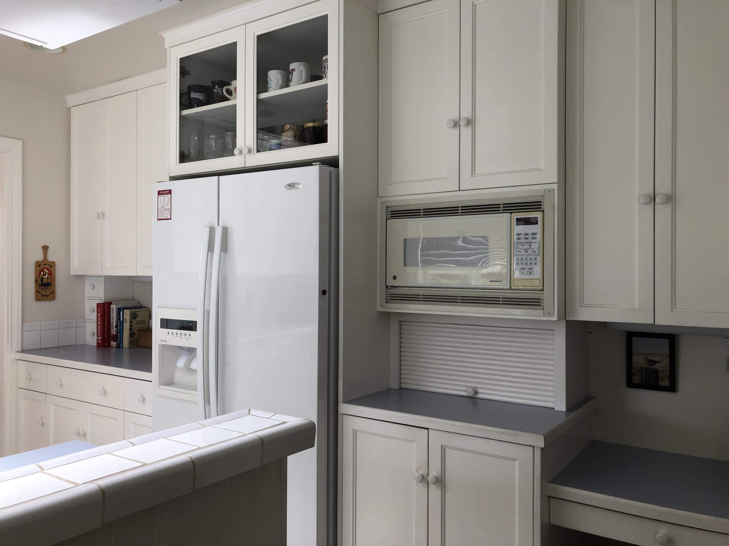 3225 Fitzpatrick Road Tillamook, OR 97141 - Photo 16 of 50 a kitchen with stainless steel appliances granite countertop a refrigerator and cabinets