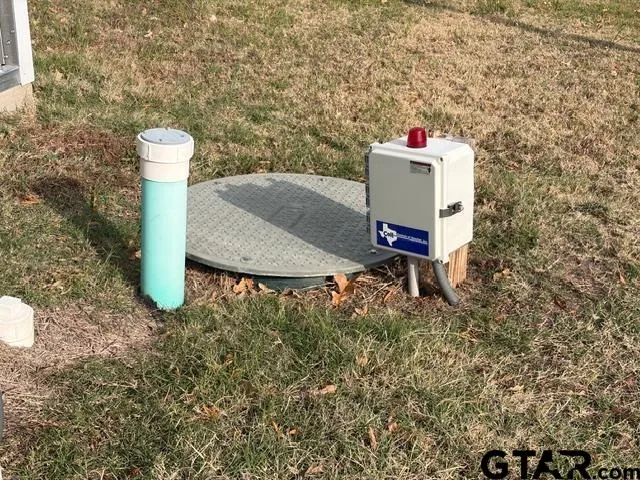 a view of a patio with table and chairs
