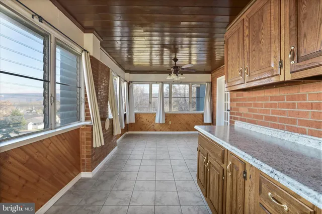 a view of a room with windows