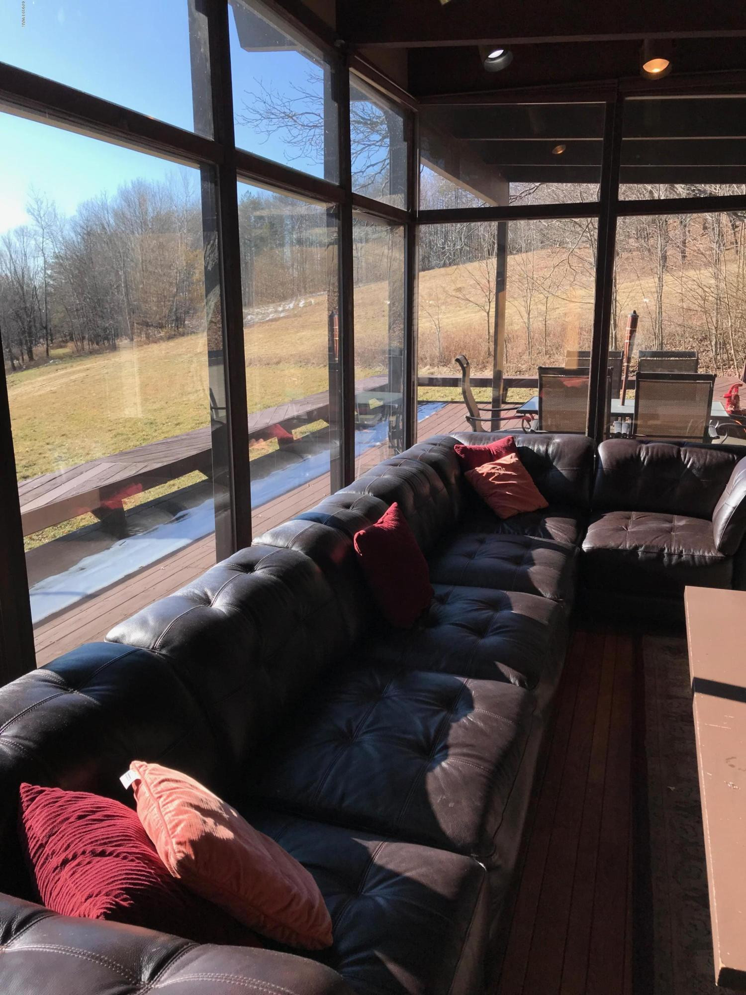 819 Wargo Road Union Dale, PA 18470 - Photo 10 of 49 a living room with furniture and a floor to ceiling window