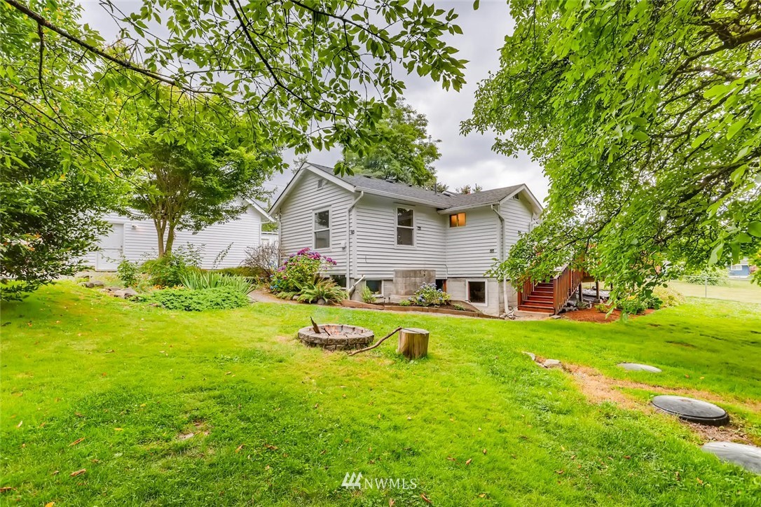 216 174th Street Southwest Bothell, WA 98012 - Photo 1 of 27 a view of backyard of house with wooden deck and seating space