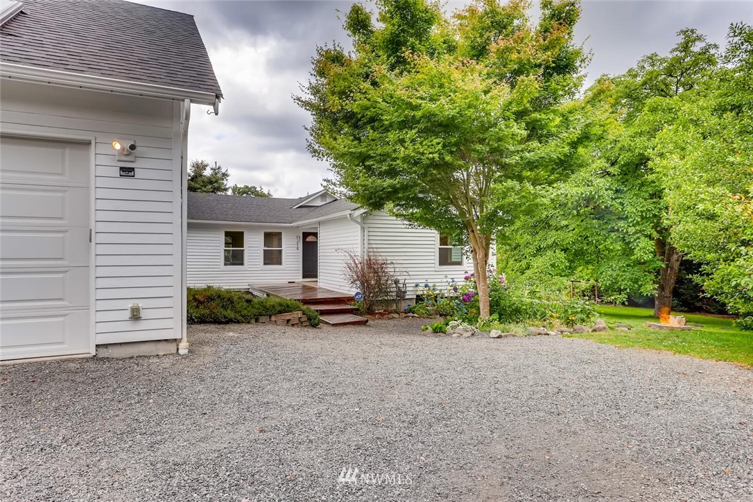 216 174th Street Southwest Bothell, WA 98012 - Photo 2 of 27 a view of a house with backyard and trees