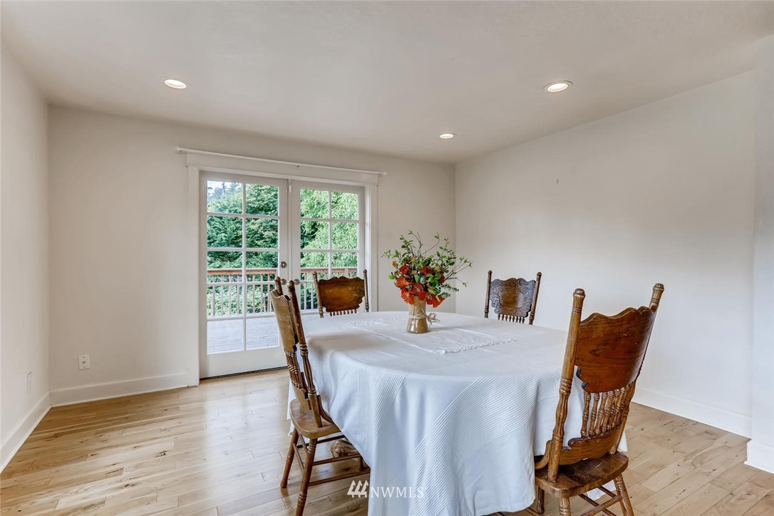 216 174th Street Southwest Bothell, WA 98012 - Photo 12 of 27 a view of a dining room with furniture and a window