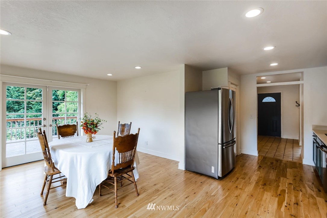 216 174th Street Southwest Bothell, WA 98012 - Photo 14 of 27 a dining room with furniture and wooden floor