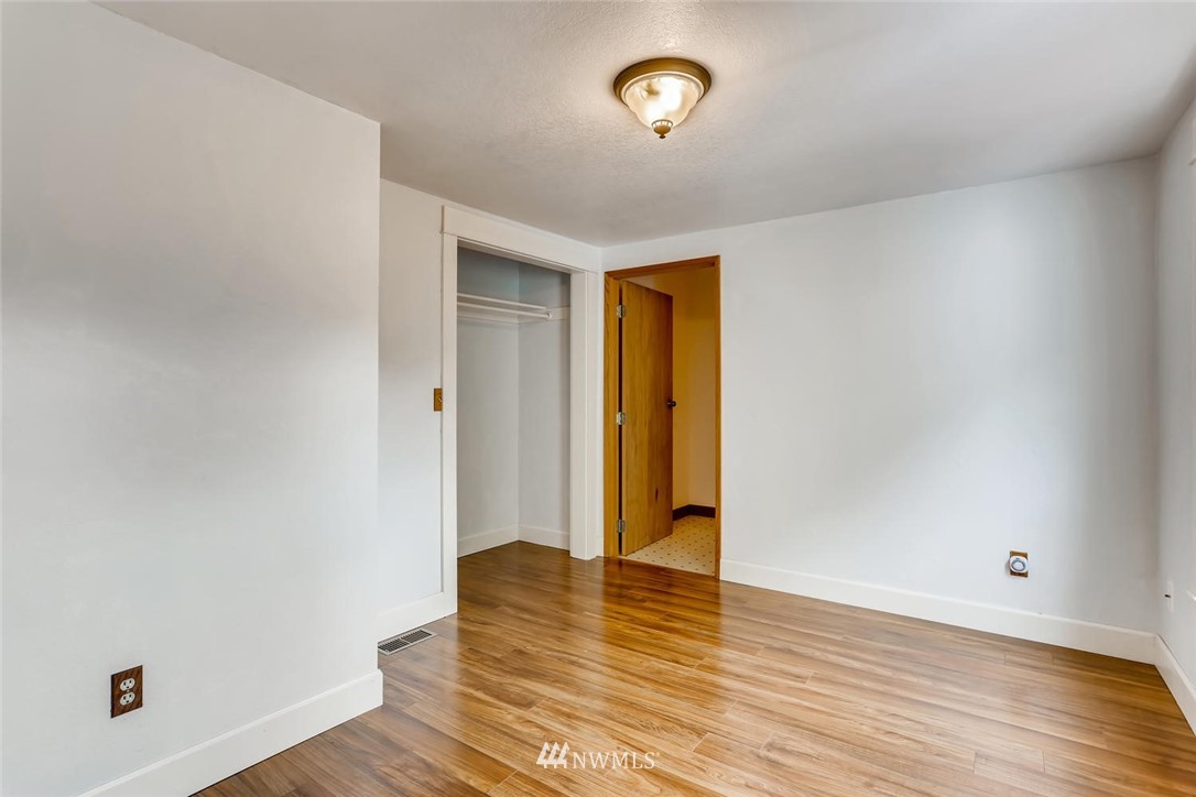 216 174th Street Southwest Bothell, WA 98012 - Photo 15 of 27 a view of an empty room with wooden floor
