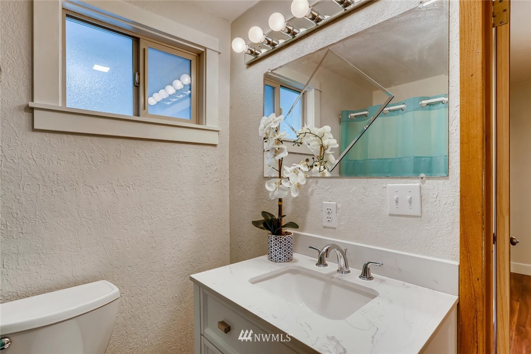216 174th Street Southwest Bothell, WA 98012 - Photo 16 of 27 a bathroom with a sink vanity mirror and toilet