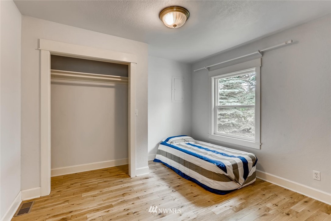 216 174th Street Southwest Bothell, WA 98012 - Photo 19 of 27 a bedroom with a bed and a window
