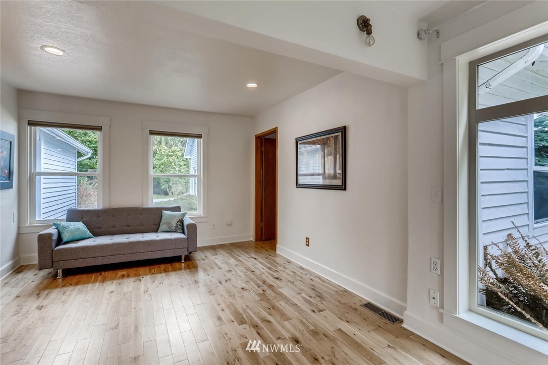 216 174th Street Southwest Bothell, WA 98012 - Photo 20 of 27 a living room with furniture and a large window