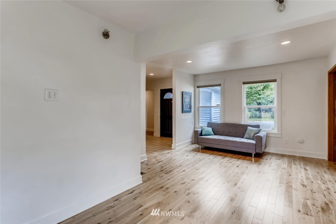 216 174th Street Southwest Bothell, WA 98012 - Photo 27 of 27 a living room with furniture and a wooden floor