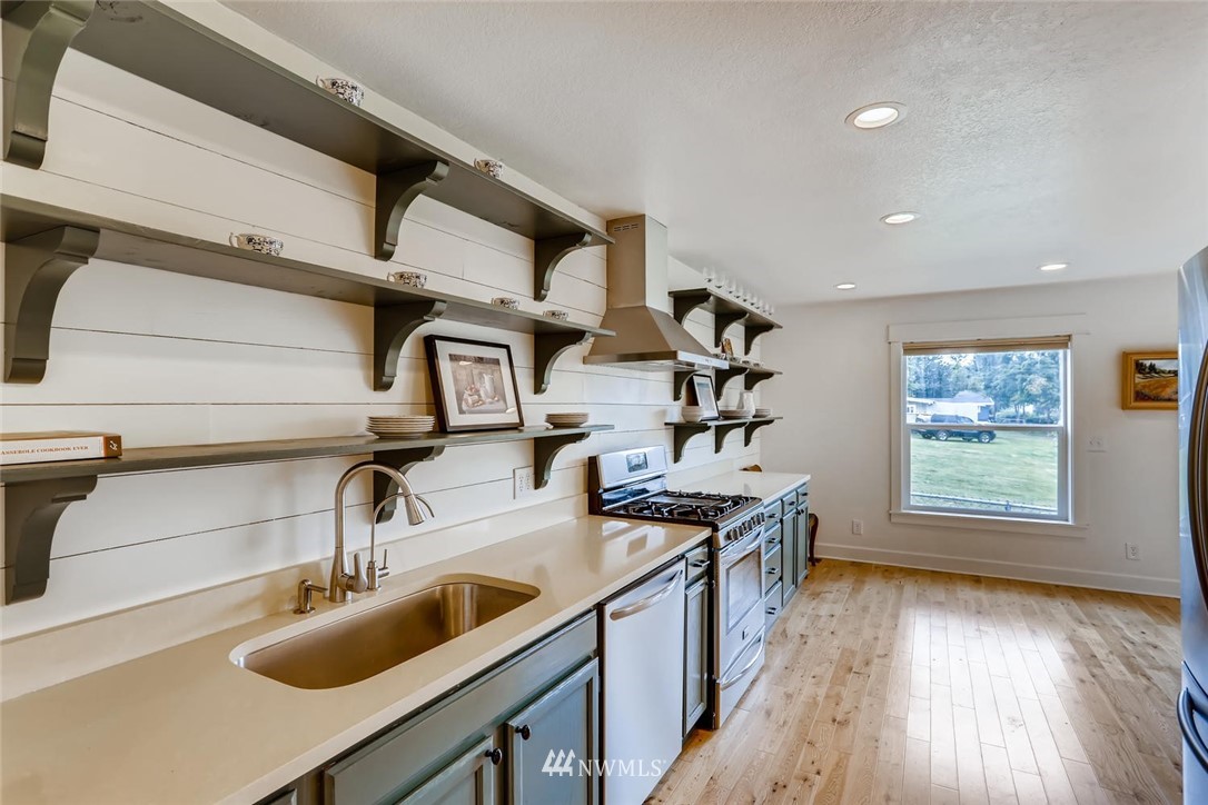 216 174th Street Southwest Bothell, WA 98012 - Photo 10 of 27 a kitchen with sink cabinets and window