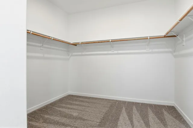 a view of an empty walk in closet