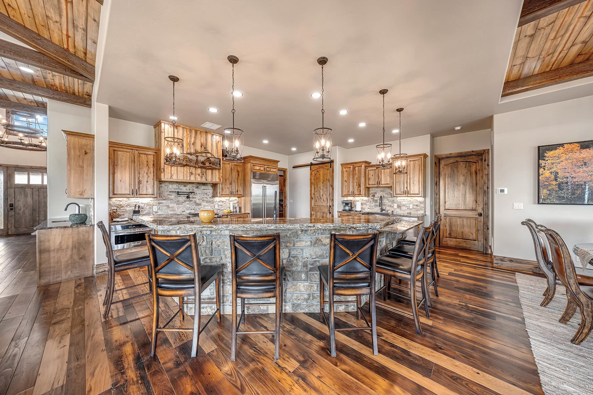 2440 J Road Grand Junction, CO 81505 - Photo 11 of 42 a dining hall with stainless steel appliances kitchen island granite countertop a dining table and chairs