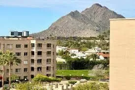 a view of a building with a yard
