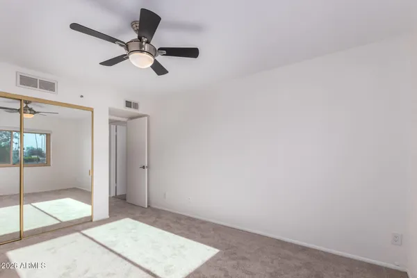 a view of an empty room and window