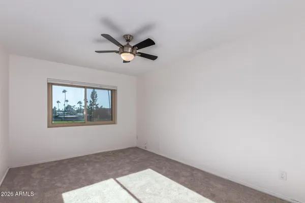 a view of a big room with wooden floor and closet