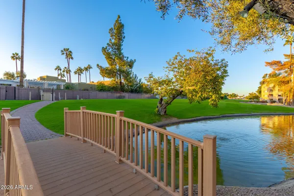 a view of yard with swimming pool and green space