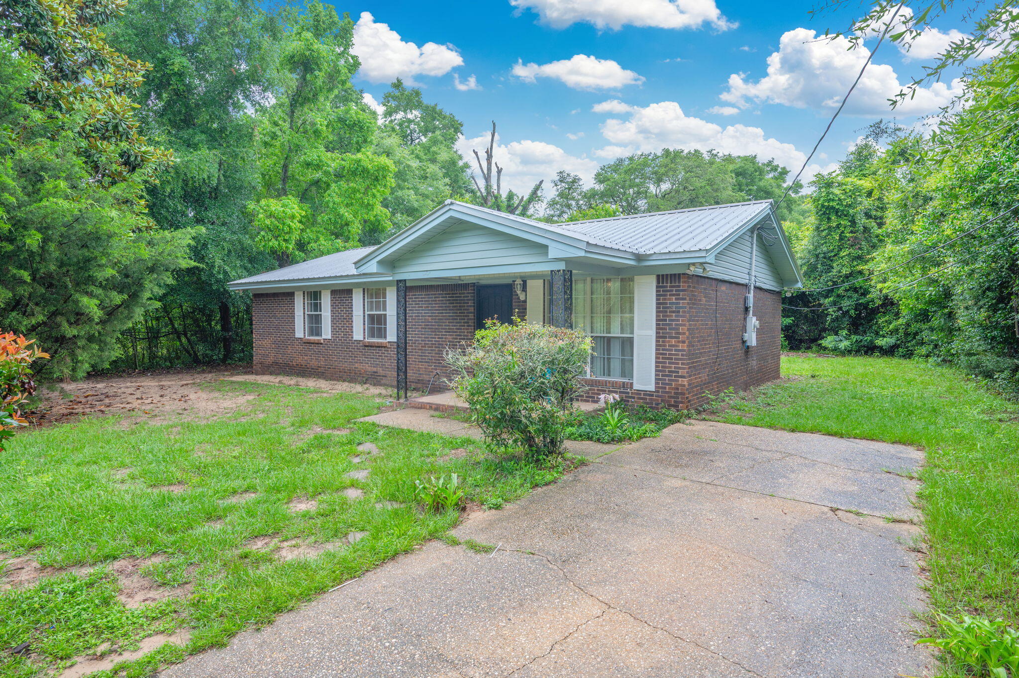 834 McDonald Street Crestview, FL 32536 - Photo 25 of 35 a front view of a house with garden