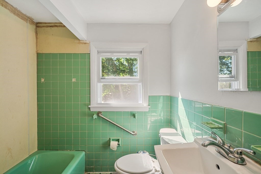 16 Blueview Road Boston, MA 02132 - Photo 13 of 33 a bathroom with a sink toilet and a mirror