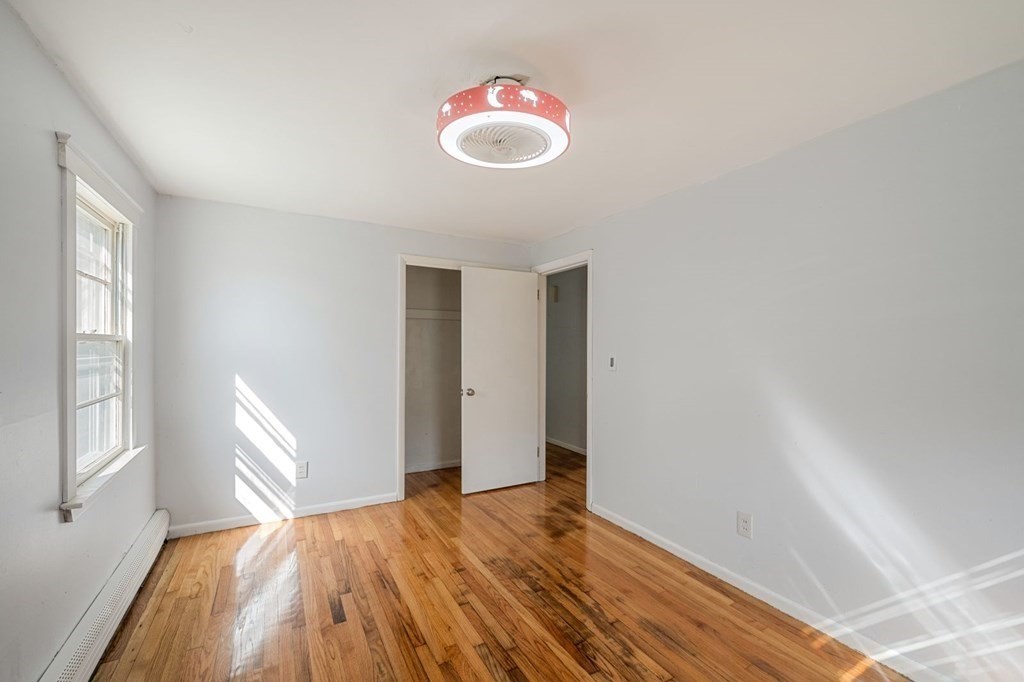 16 Blueview Road Boston, MA 02132 - Photo 15 of 33 a bedroom with a bed and a window