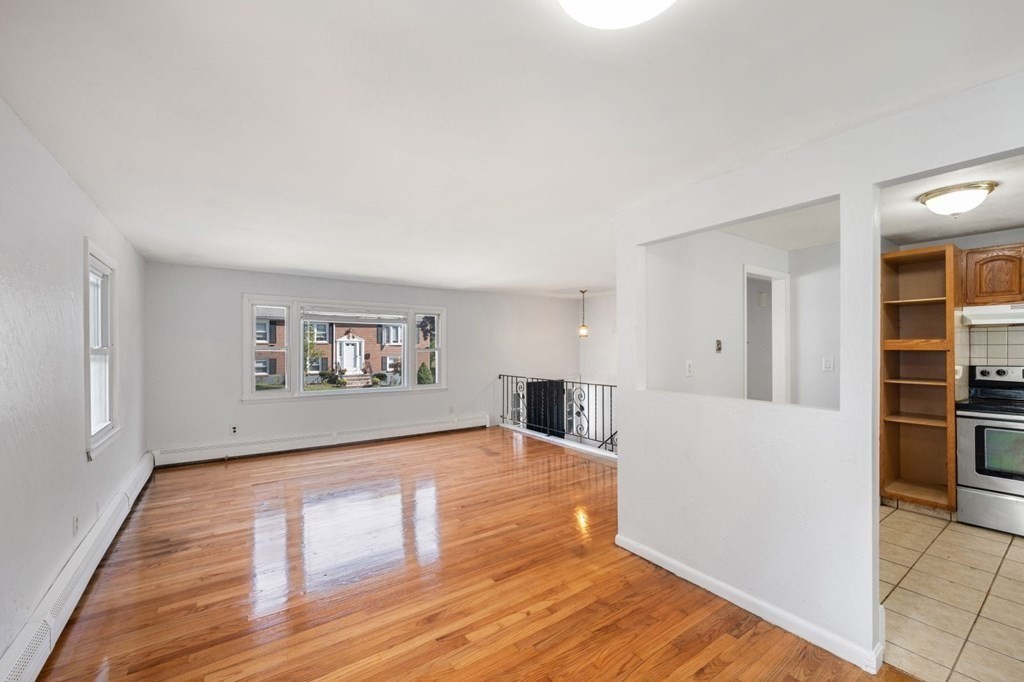 16 Blueview Road Boston, MA 02132 - Photo 2 of 33 a view of empty room with wooden floor