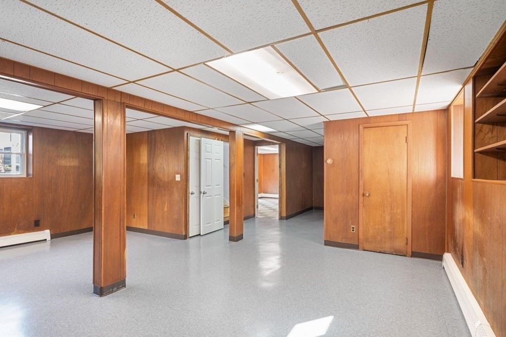 16 Blueview Road Boston, MA 02132 - Photo 22 of 33 a view of empty room with wooden floor