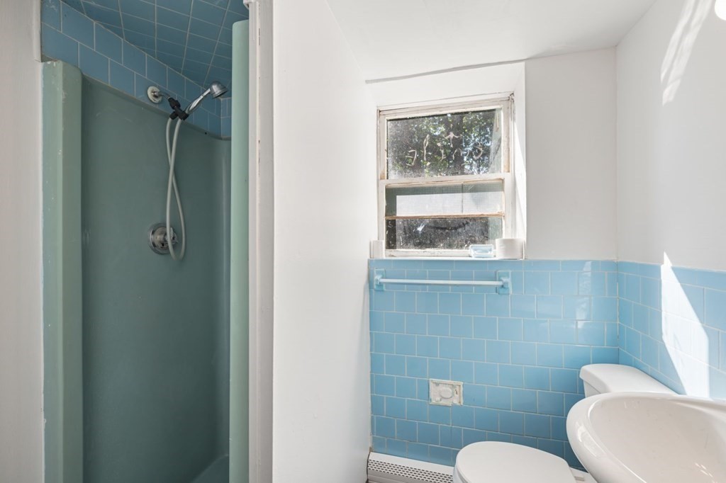 16 Blueview Road Boston, MA 02132 - Photo 25 of 33 a bathroom with a toilet sink and window