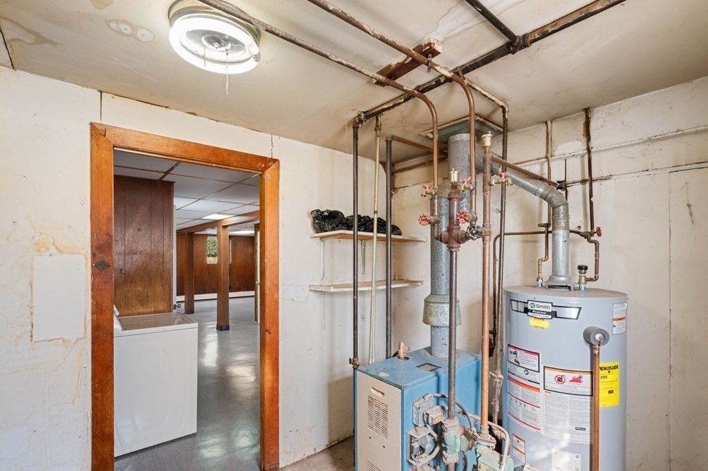 16 Blueview Road Boston, MA 02132 - Photo 28 of 33 a view of a walk in closet and bathroom