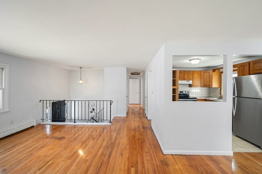 16 Blueview Road Boston, MA 02132 - Photo 3 of 33 a view of livingroom with furniture and wooden floor