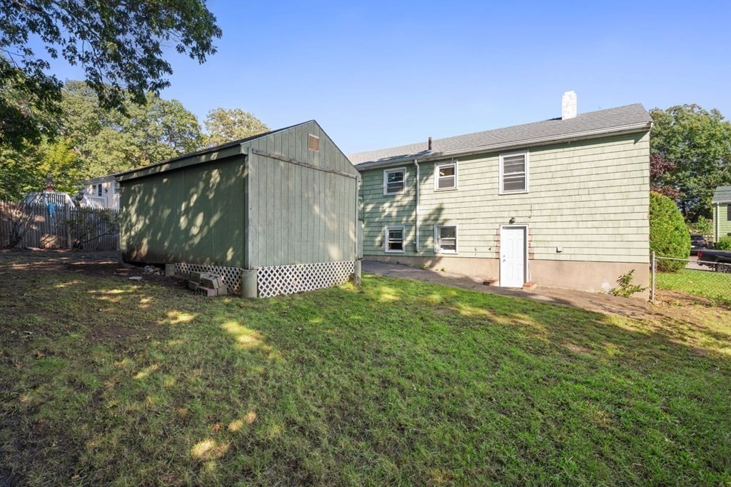 16 Blueview Road Boston, MA 02132 - Photo 31 of 33 a backyard of a house with lots of green space