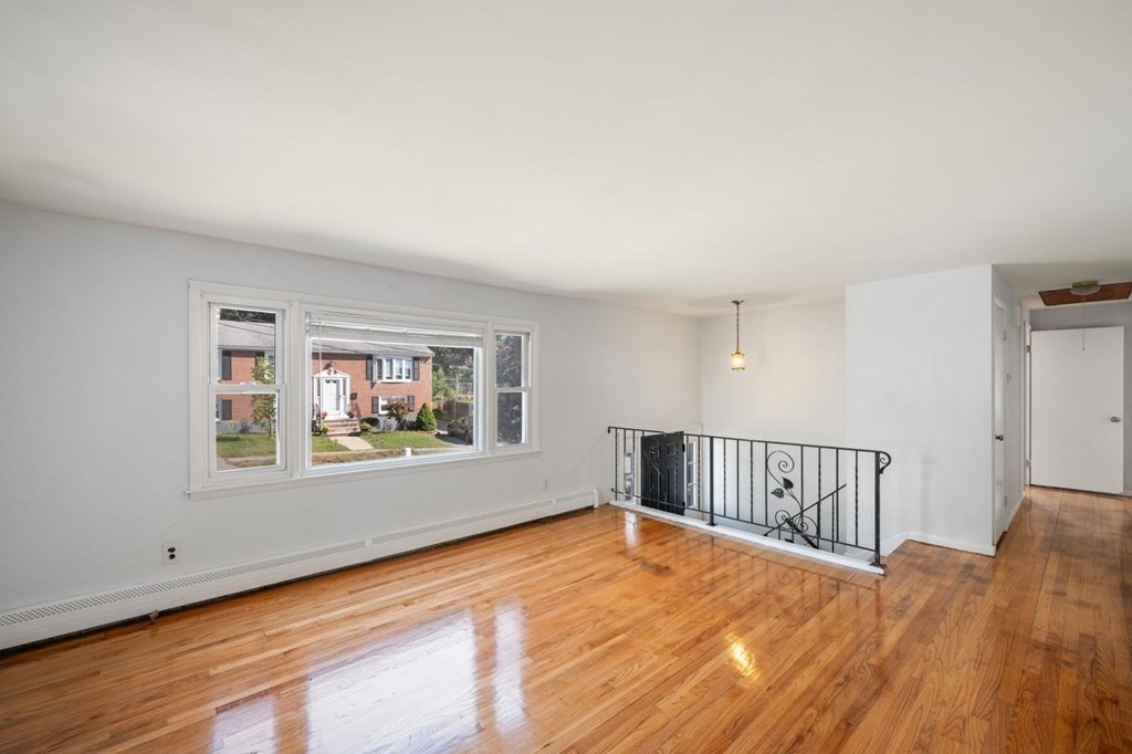 16 Blueview Road Boston, MA 02132 - Photo 4 of 33 a view of a room with wooden floor and window