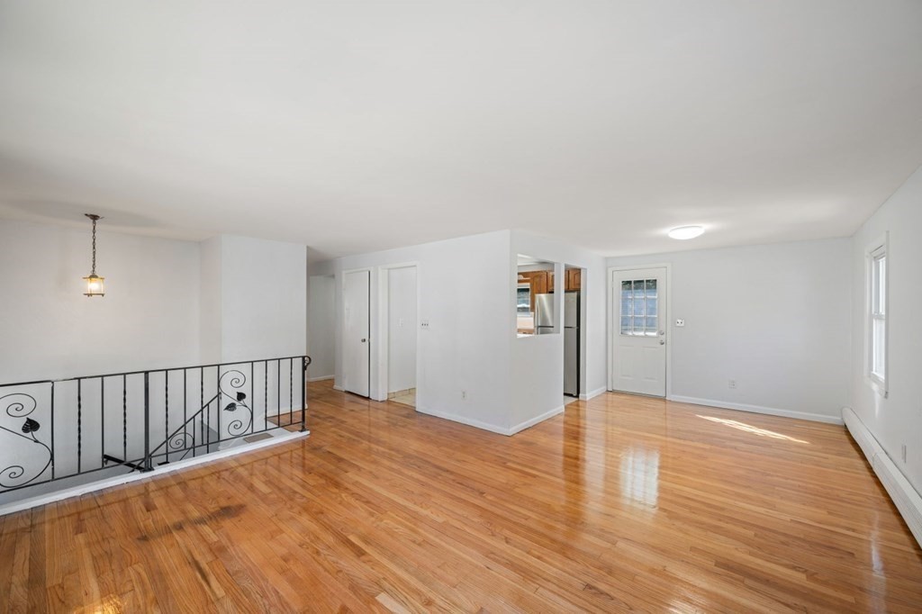 16 Blueview Road Boston, MA 02132 - Photo 5 of 33 a view of a big room with wooden floor