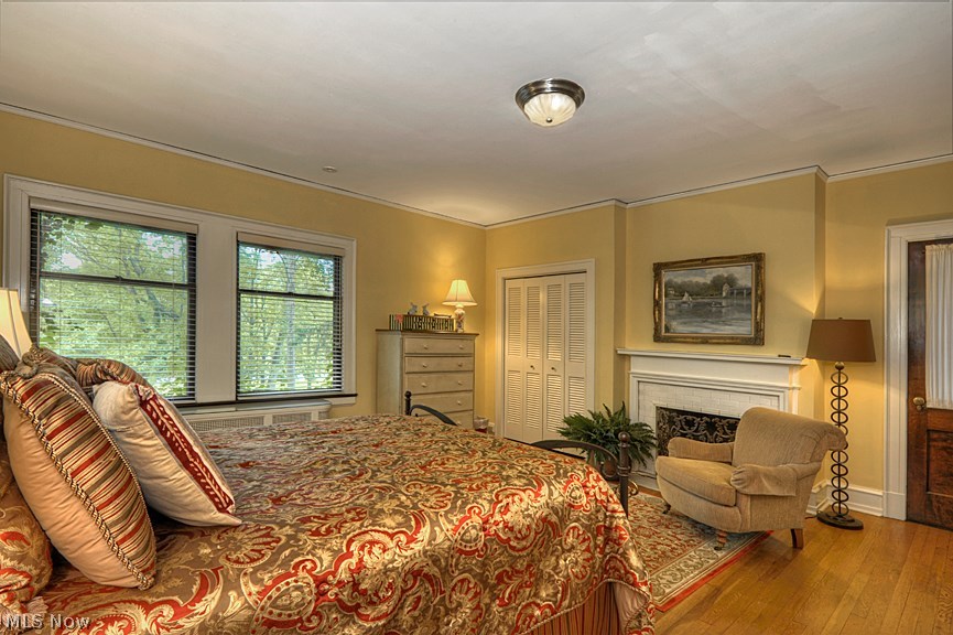 2444 Coventry Road Cleveland, OH 44106 - Photo 20 of 33 Master bedroom with several closets, gas fireplace, access to sleeping porch, master bath and second bedroom. Hardwood floors and central air.