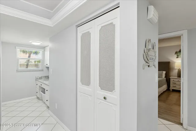 a view of a bedroom from a hallway