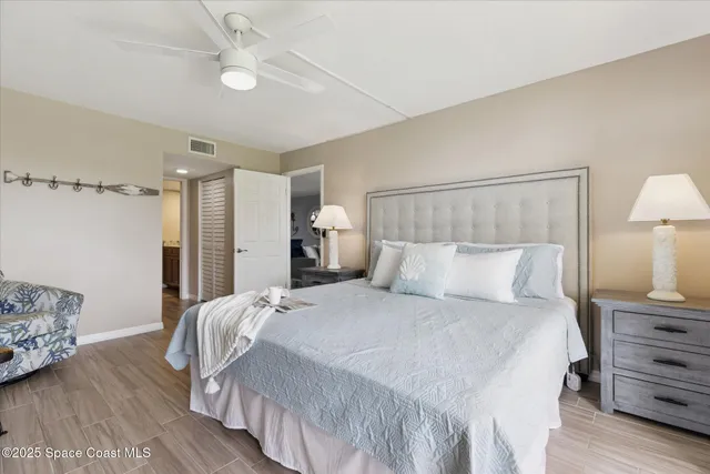 a bedroom with a bed and a lamp